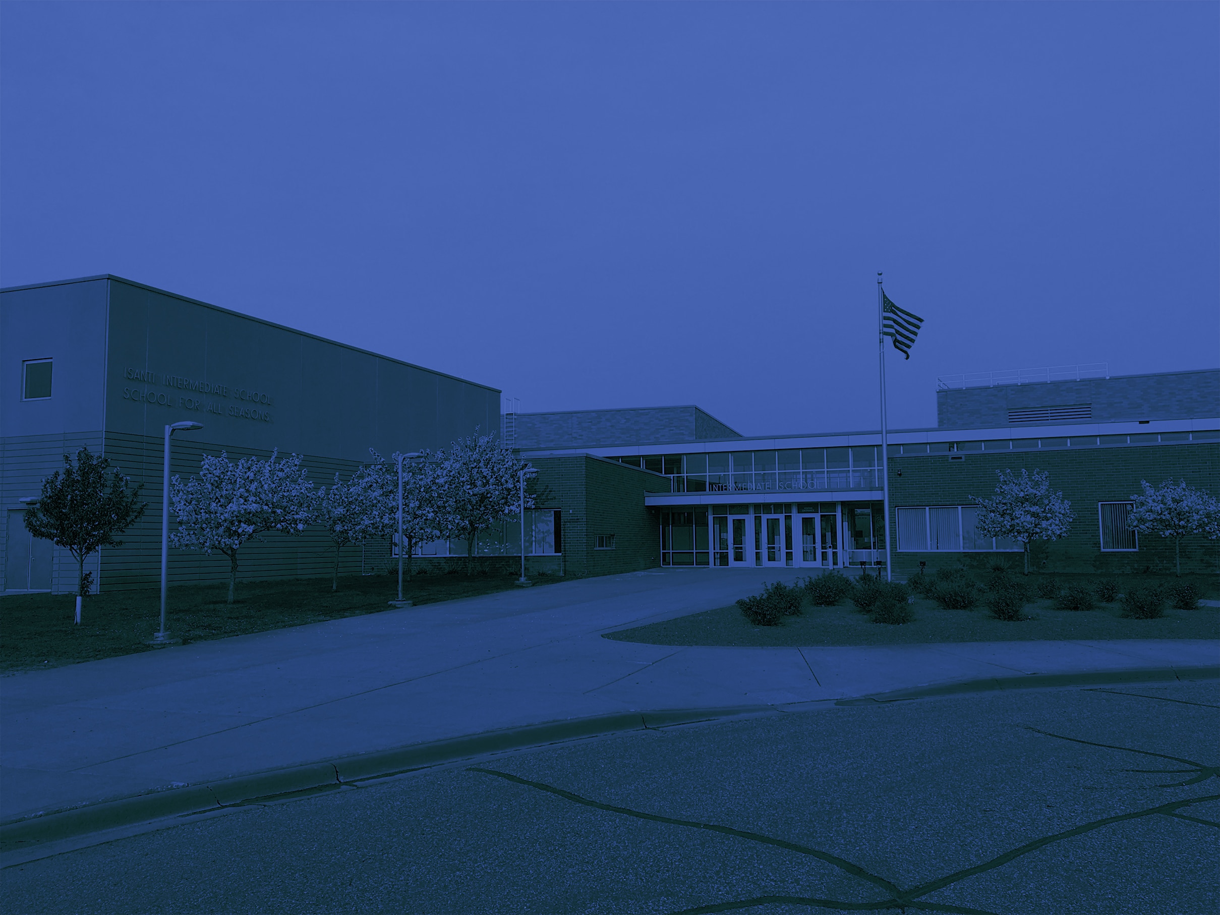 Outdoor view of high school with blue overlay