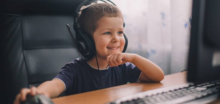 Young boy completig a speech therapy session online