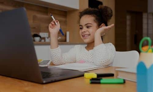 Young girl participating in teletherapy session online